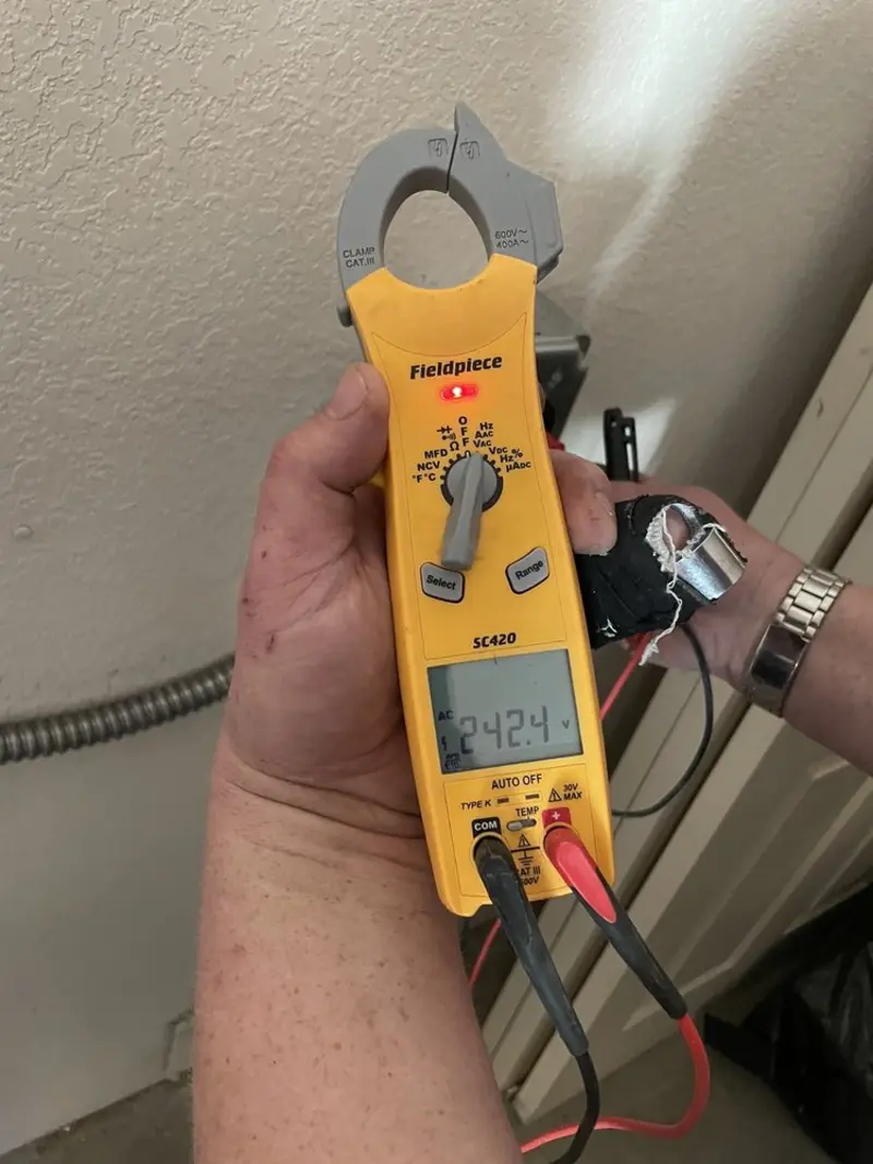 Voltage testing with clamp meter during Recessed Lighting Installation in Lake Clarke Shores